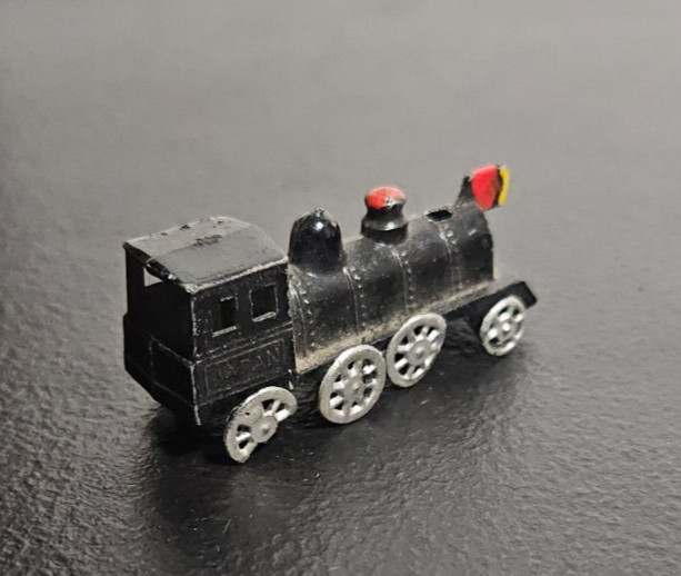 STEAM ENGINE LOCOMOTIVE, TRAIN. DIE CAST METAL, BLACK PAINTED. MARKED JAPAN