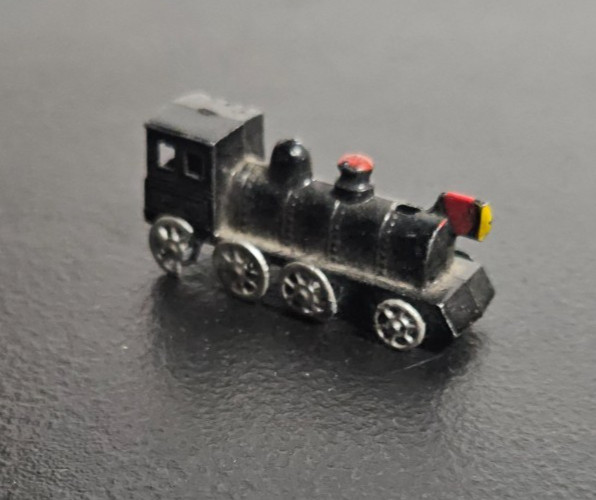 STEAM ENGINE LOCOMOTIVE, TRAIN. DIE CAST METAL, BLACK PAINTED. MARKED JAPAN