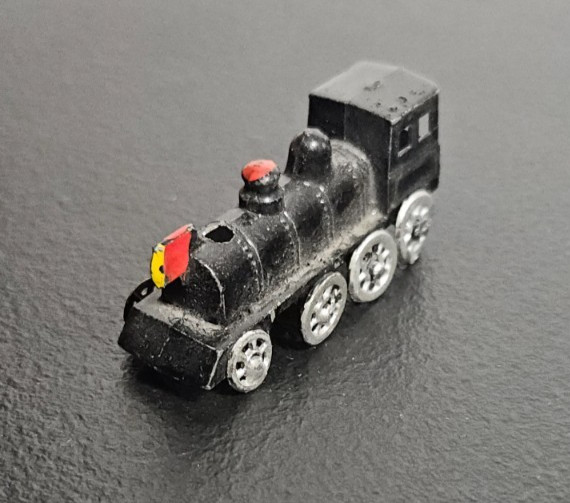 STEAM ENGINE LOCOMOTIVE, TRAIN. DIE CAST METAL, BLACK PAINTED. MARKED JAPAN