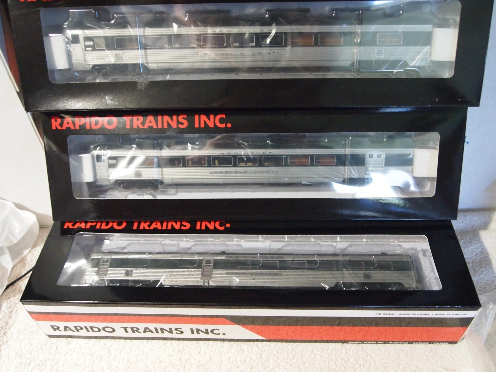 NEW HAVEN GREEN WINDOW BAND AS DELIVERED 5 RAPIDO LIGHTED PASSENGER CARS
