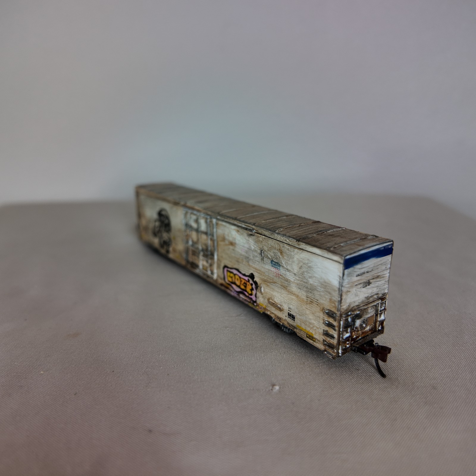 N-scale hand-painted tagged and weathered boxcar