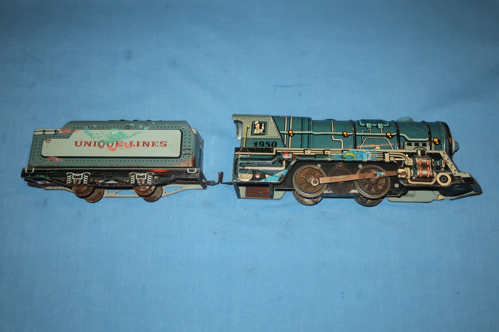 Unique Art Lines #1950 Tin Litho Steam Locomotive and Tender. Runs well