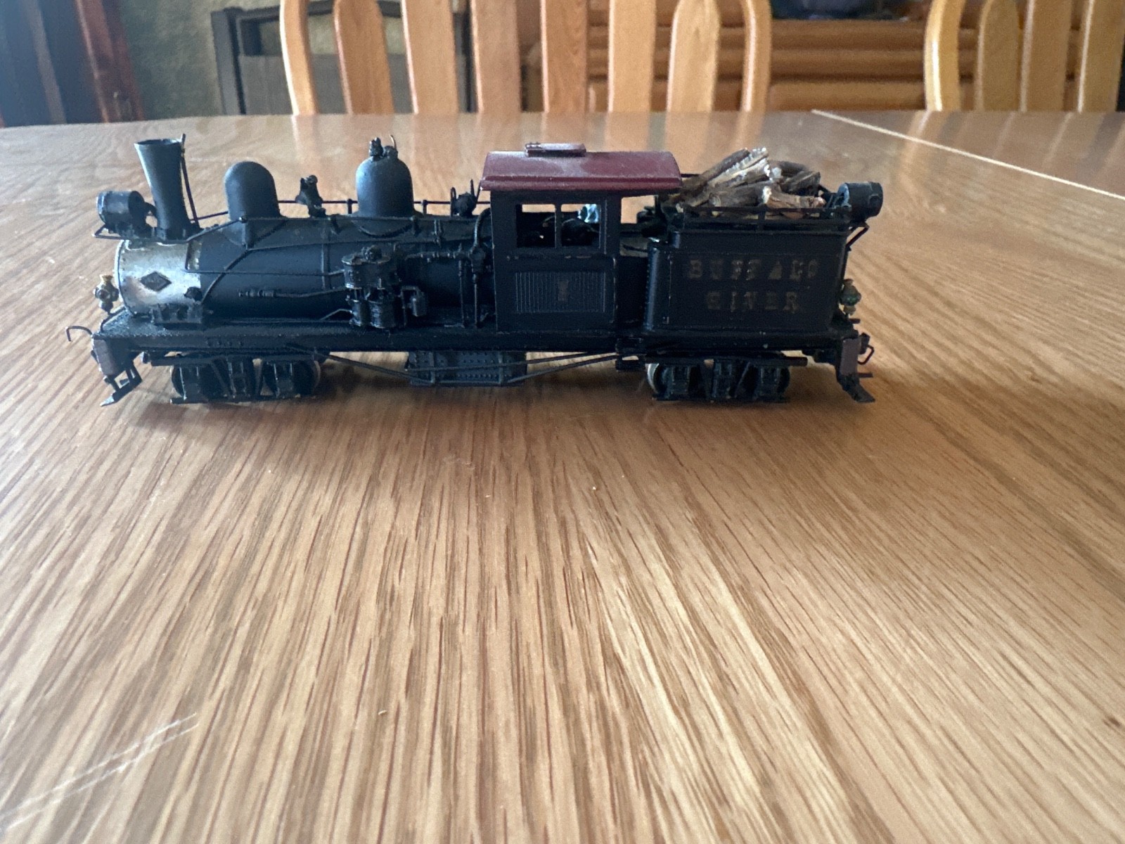 two truck pacfic fast mail shay with 2 weathered log cars and a gondola car