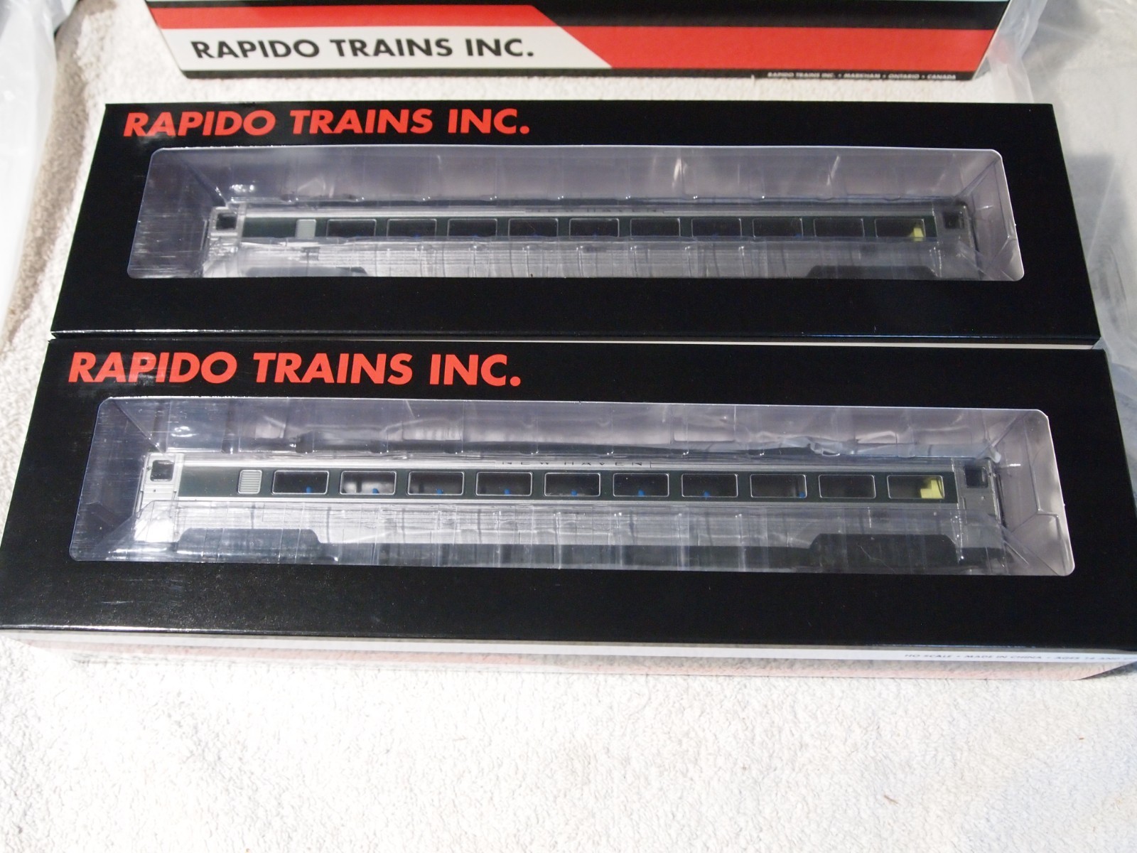 NEW HAVEN GREEN WINDOW BAND AS DELIVERED 5 RAPIDO LIGHTED PASSENGER CARS