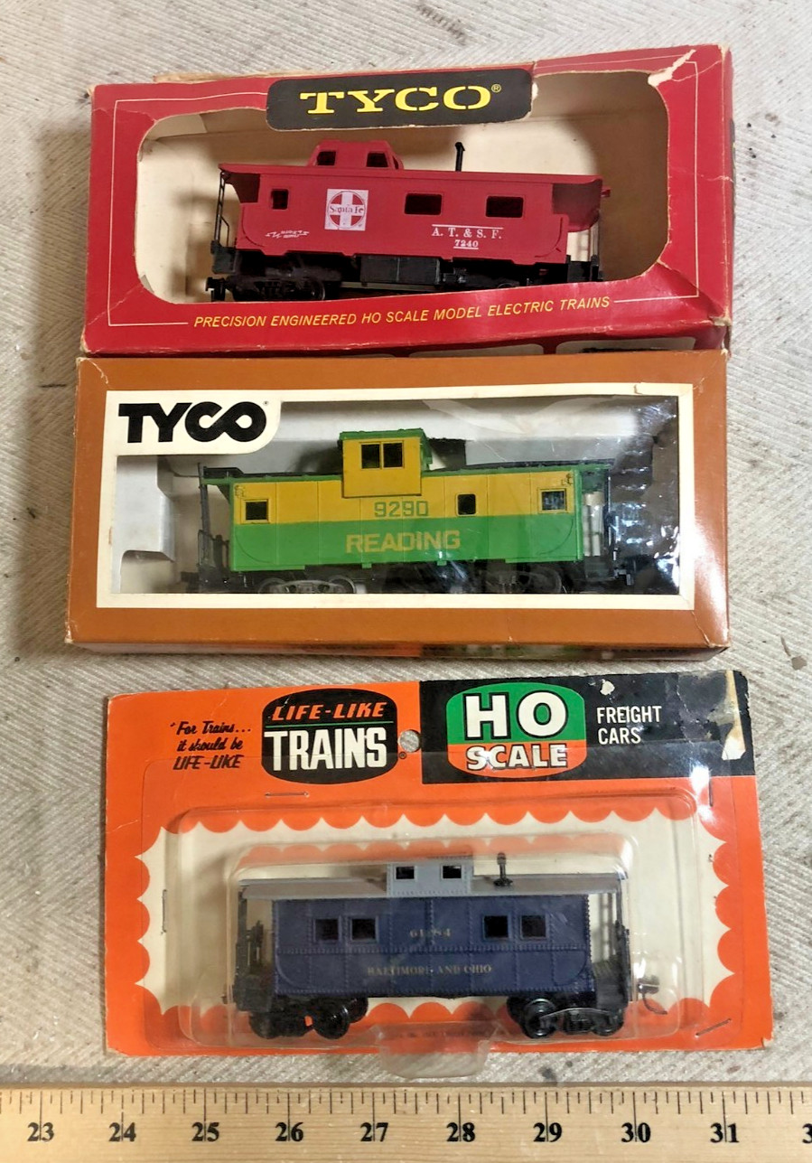 HO cabooses: 2 Tyco (Reading wide vision, AT&SF), one Life Like (B&O) (C)