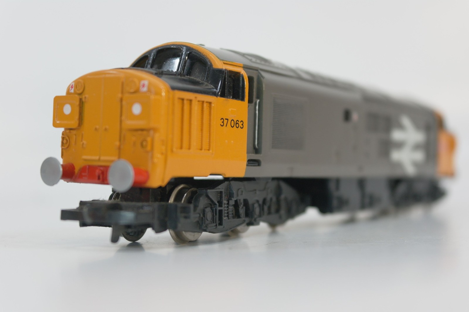 Hornby R348B Class 37 37063 plus three Shellstar bogie rail vans. Used. OO Gauge