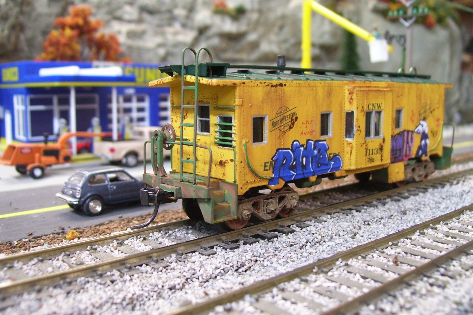 Custom Athearn Chicago &Northwestern bay window caboose.