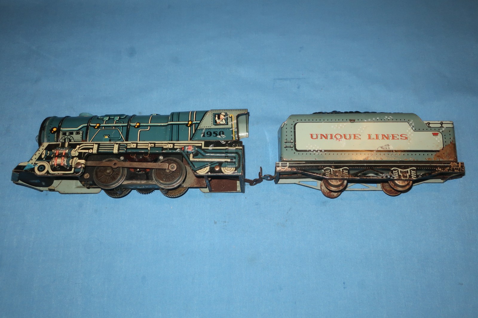 Unique Art Lines #1950 Tin Litho Steam Locomotive and Tender. Runs well