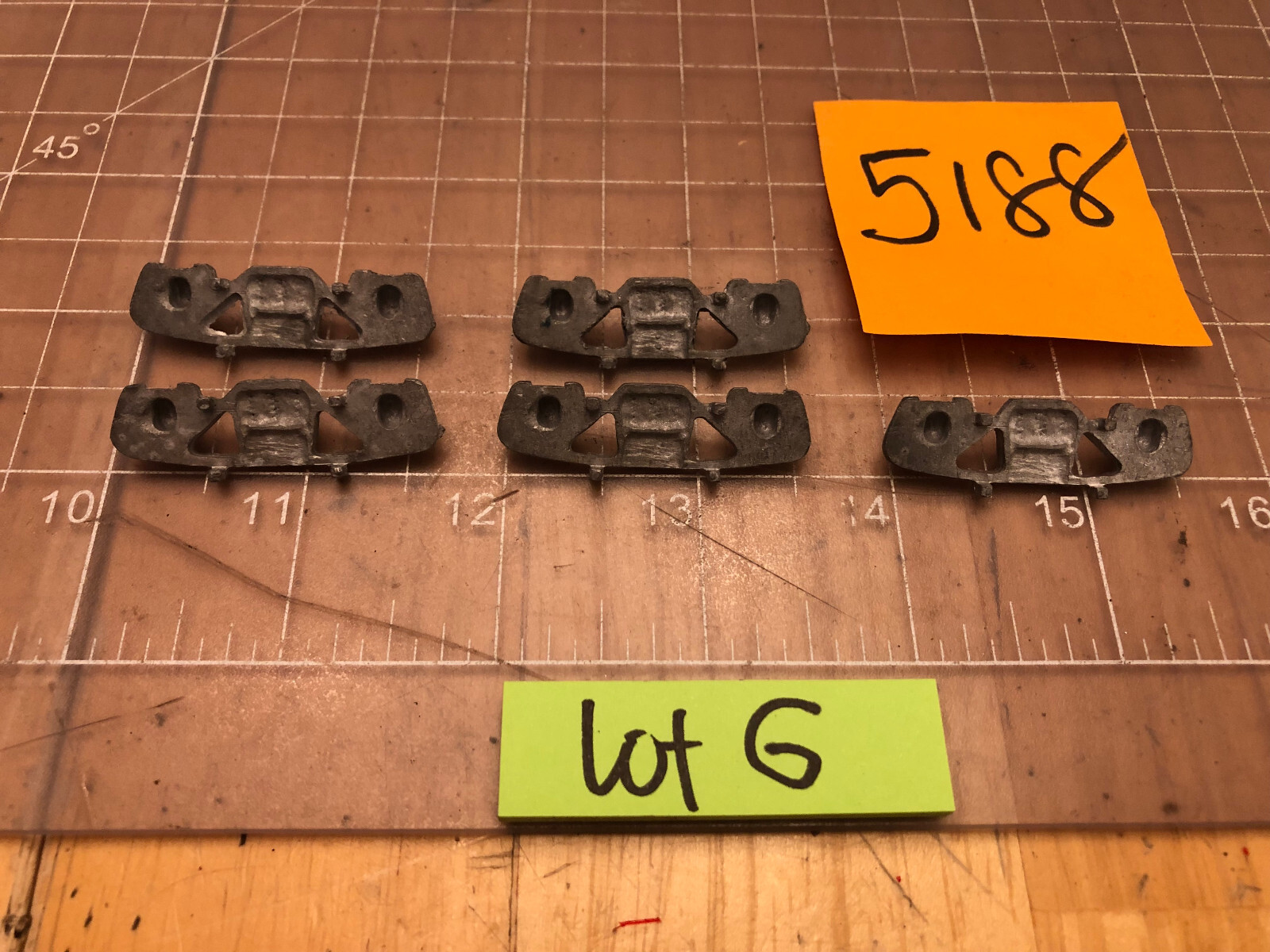 UNMARKED Brand of 5 CAST METAL TRAIN Side Truck Covers 5188 PART Lot G