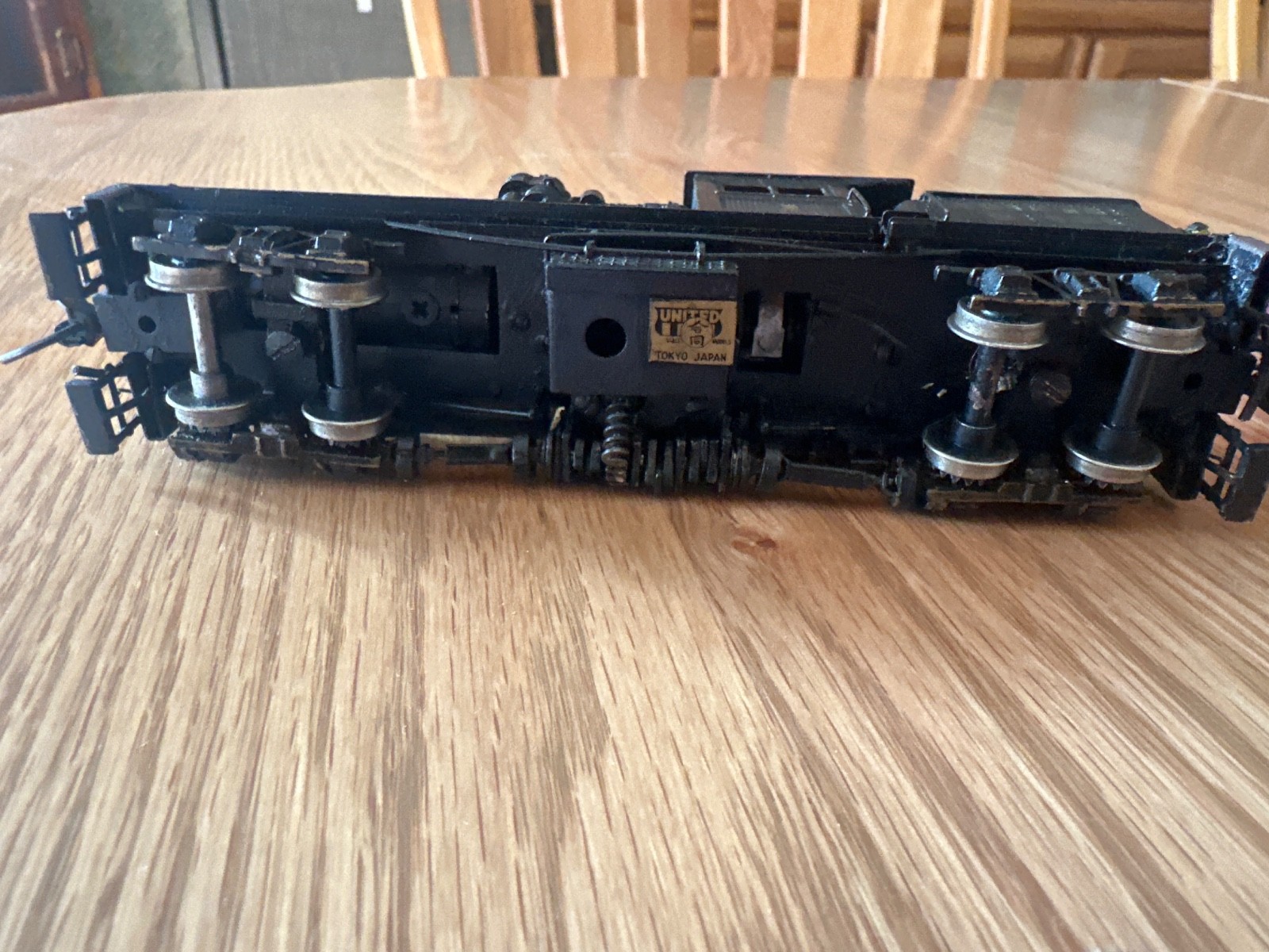 two truck pacfic fast mail shay with 2 weathered log cars and a gondola car