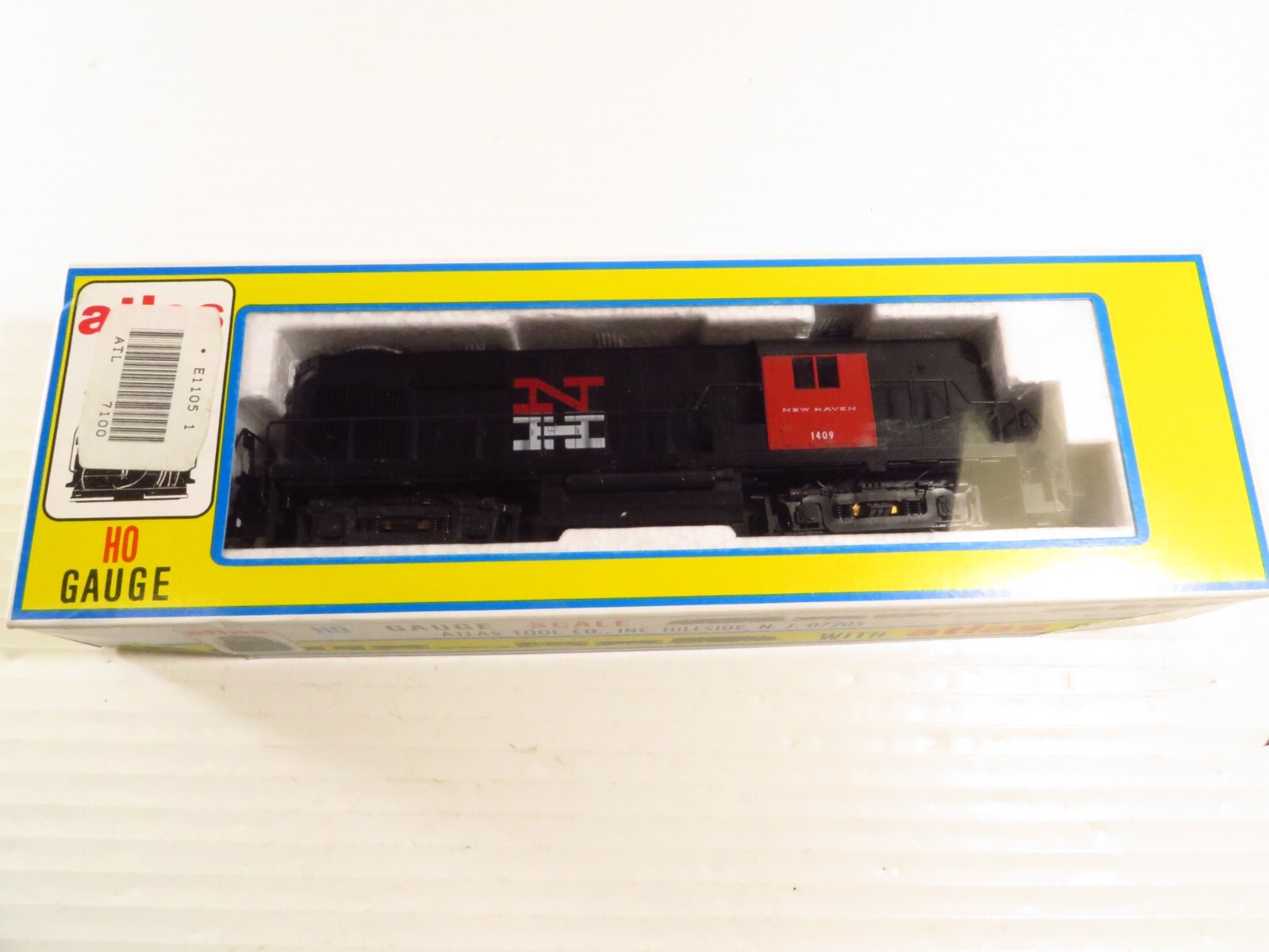 Atlas 7100 HO New Haven RS-11 Diesel Locomotive #1409, Brand NEW in Box
