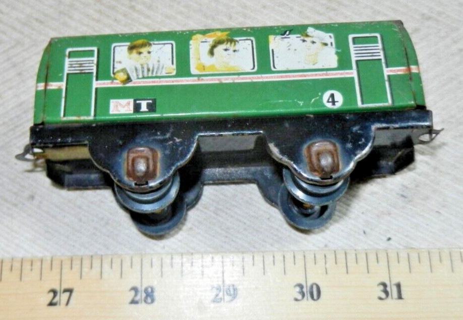 Older Tin Lithographed MT 4 Passenger Coach with plastic wheels – by who?