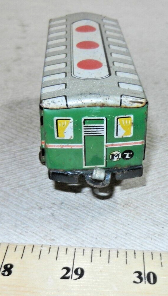 Older Tin Lithographed MT 4 Passenger Coach with plastic wheels – by who?