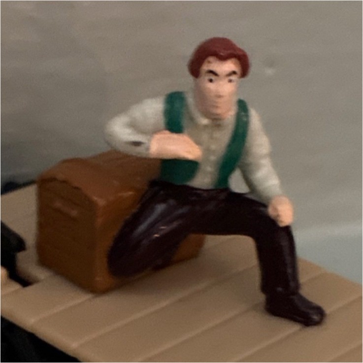 Model Railroad Locomotive Flat Car with Seated Figure and Brown Box