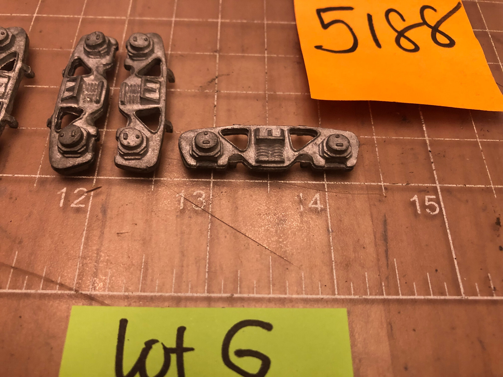 UNMARKED Brand of 5 CAST METAL TRAIN Side Truck Covers 5188 PART Lot G