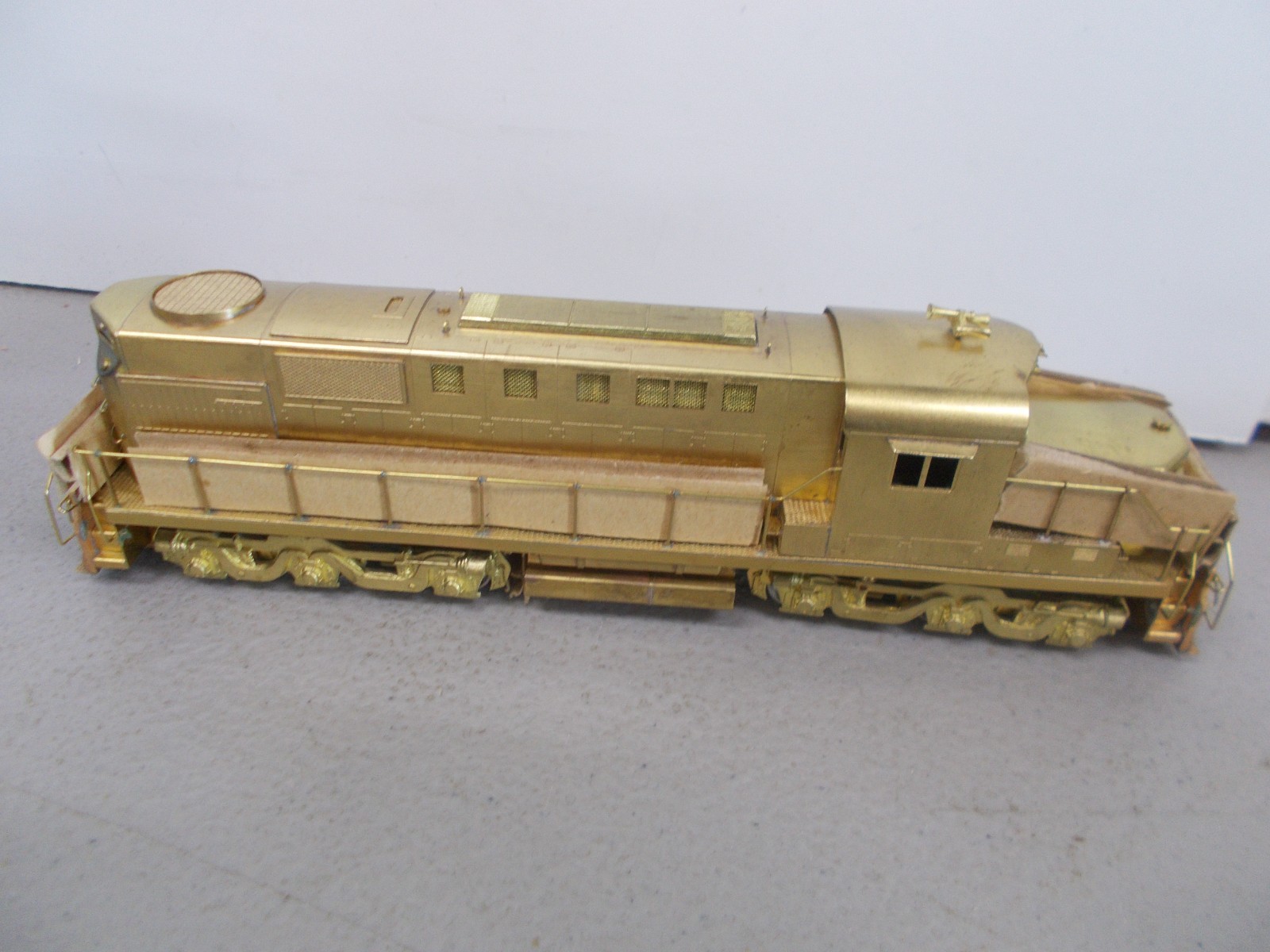 ALCO # D-124L ~ BRASS~ DL-702 POWERED LOCOMOTIVE ~NOS-RUNS GOOD~HO SCALE~LOT-B