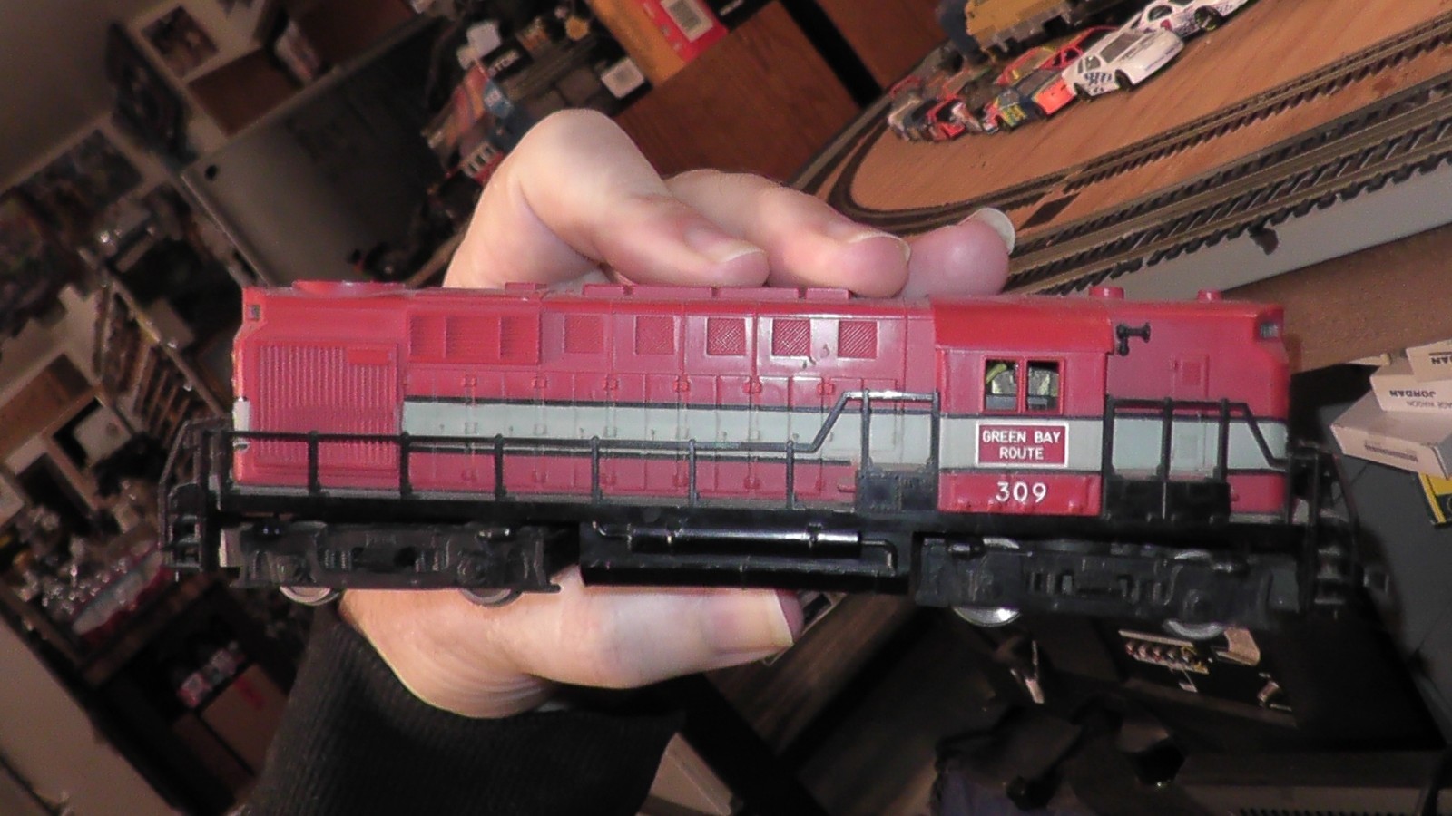 ho unbranded diesel locomotive green bay route runs on track