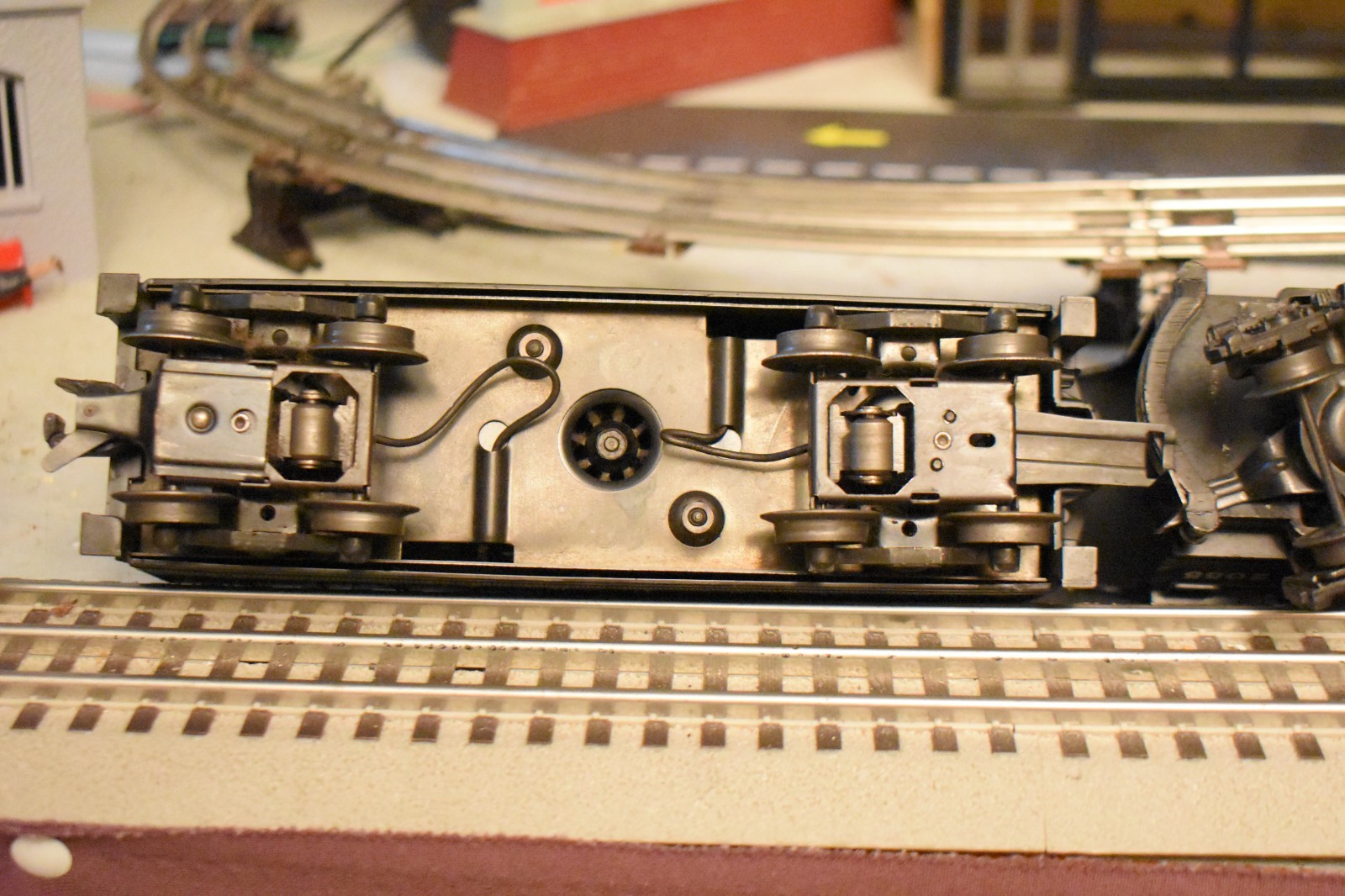 Lionel 2055 steam locomotive & 6026W Tender and 3 rolling stock cars.