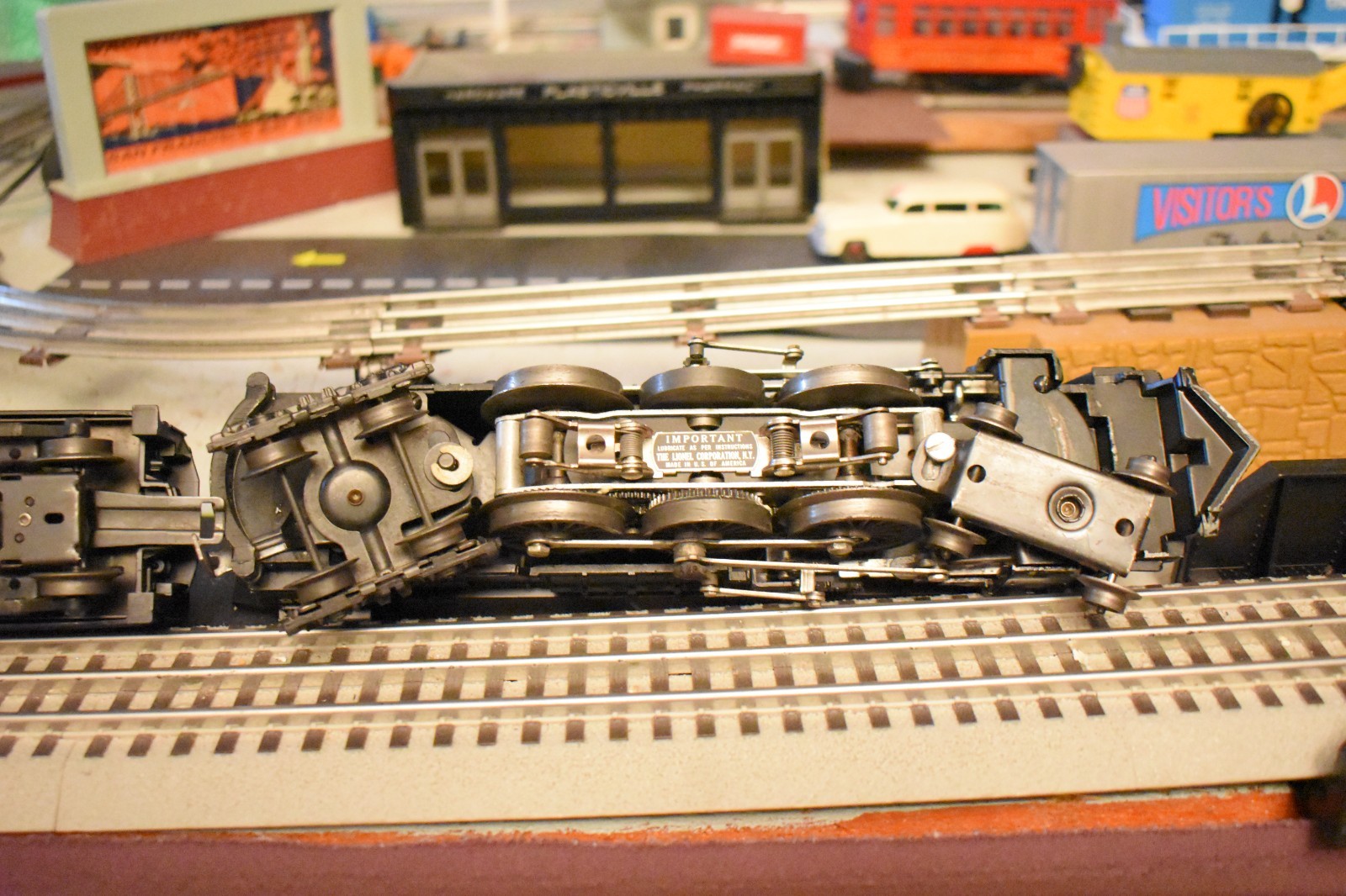 Lionel 2055 steam locomotive & 6026W Tender and 3 rolling stock cars.